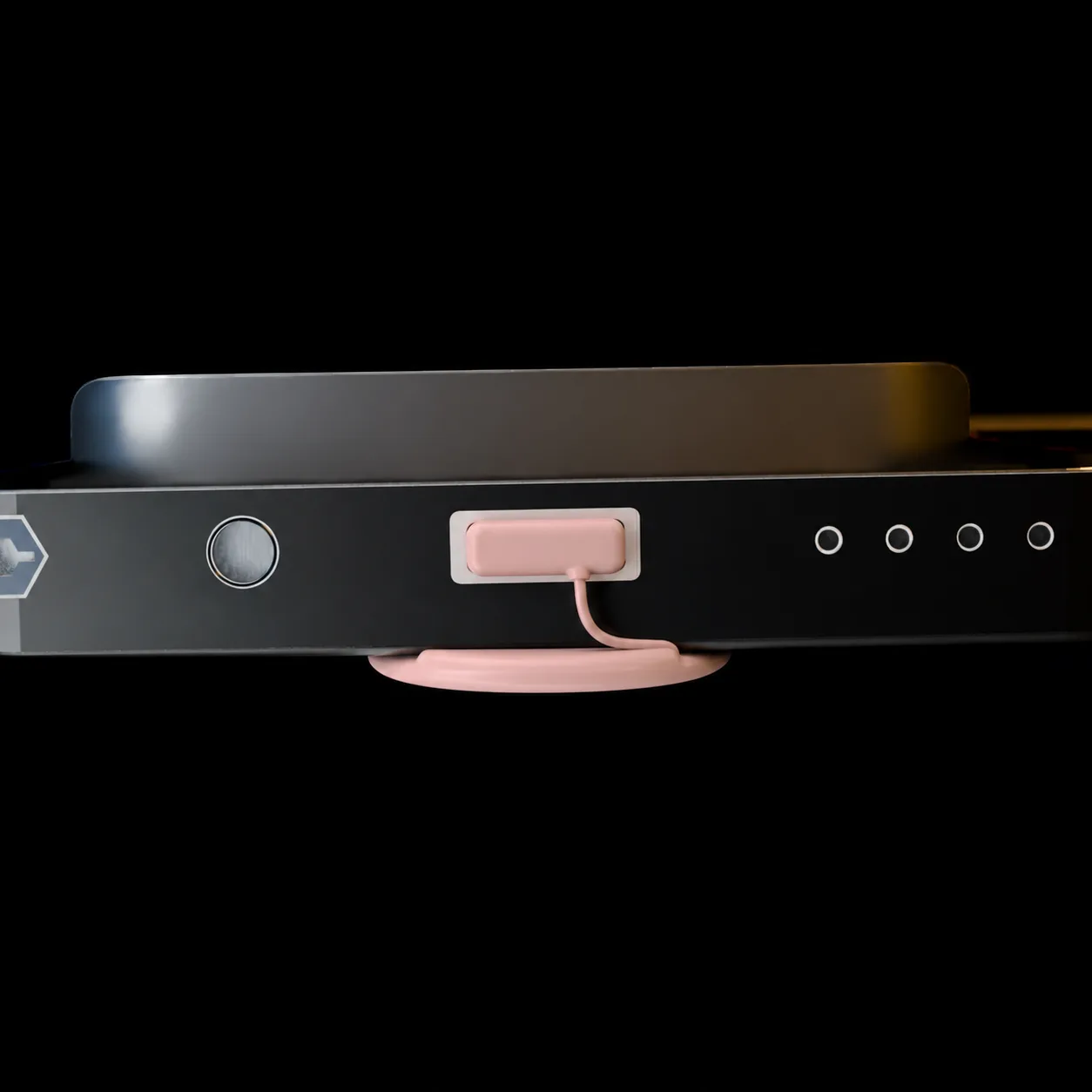 B.Line bottom edge with a rose-pink tethered USB-C dust plug and ergonomic pinky rest