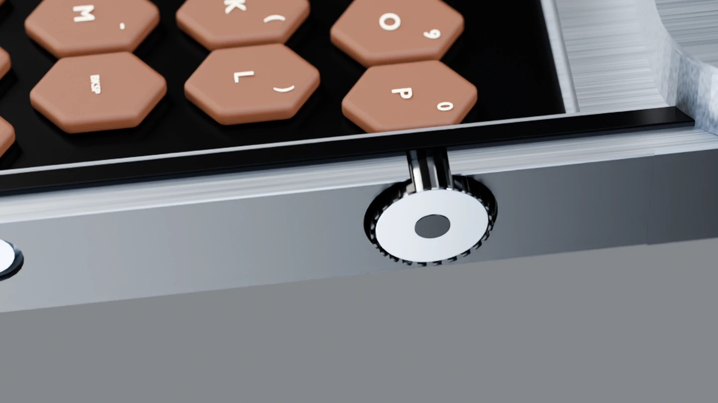 Close-up of the round knurled navigation wheel beside the keyboard